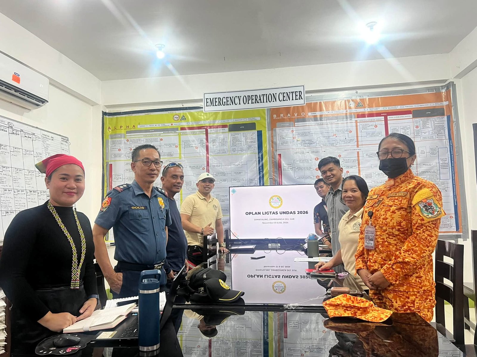 Agency representatives at the Dimataling emergency operations centre.